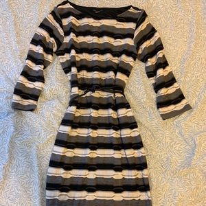 Knee length long sleeved dress with belt